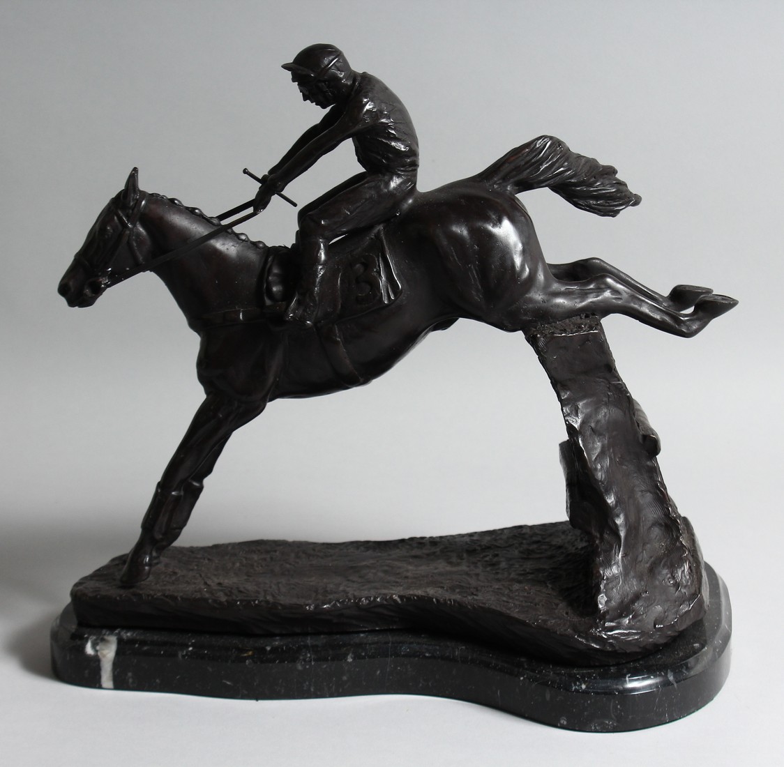 A BRONZE HORSE AND JOCKEY over the sticks, on a marble base. - Image 2 of 2