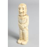 A HAND CARVED BONE FIGURE as a cork screw. 4.5ins long.