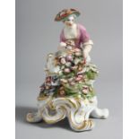 A BOW FIGURE OF SPRING seated on a four footed base while holding flowers.