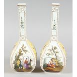 A GOOD PAIR OF AUGUSTUS REX DRESDEN BOTTLE VASES yellow panels with flowers and panels of figures. A