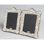 A PAIR OF SILVER PHOTOGRAPH FRAMES. 7.5ins x 5.5ins.
