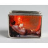 A SILVER PILL BOX the enamel top with a nude. 1.25ins