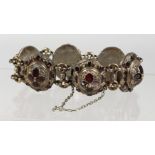 A GOOD ISLAMIC SILVER RUBY SET BRACELET.