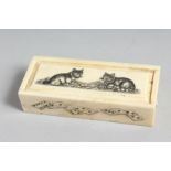 A BONE DICE BOX etched with cats. 4.5ins long.