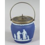 A WEDGWOOD JASPER WARE CIRCULAR BISCUIT CADDY AND COVER.