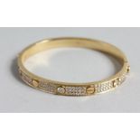 A SUPERB 18CT GOLD AND DIAMOND SCREW BANGLE set with six single stone diamonds and twelve rows of