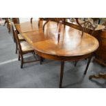 A George III design mahogany D-end dining table with two leaves.