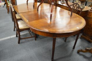 A George III design mahogany D-end dining table with two leaves.