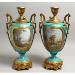 A VERY GOOD PAIR OF 19TH CENTURY SEVRES PALE BLUE LAMPS with reverse panels of figures and