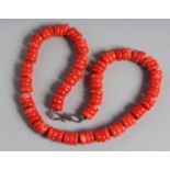 A CORAL SWEETIE STYLE BEAD NECKLACE. 17ins long.