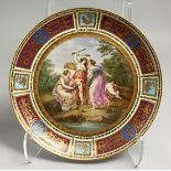 A SUPERB 19TH CENTURY VIENNA CIRCULAR PLATE "Amor und Drei Gracien". Beehive mark in blue, 11.5ins