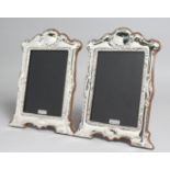 A PAIR OF SILVER PHOTOGRAPH FRAMES. 7.5ins x 5.5ins.