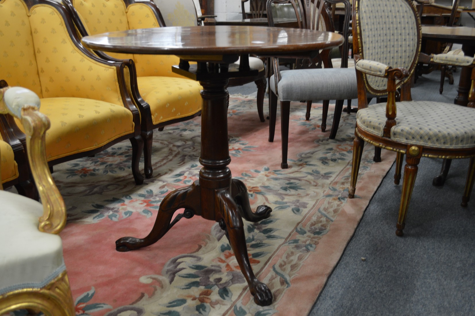 A good George III mahogany circular tilt top tripod table with bird-cage action.