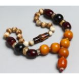 A LARGE AMBER AND STONE NECKLACE.