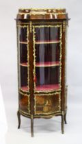 A GOOD LOUIS XVI STYLE KINGWOOD VITRINE (19TH CENTURY) with ormolu mounts, the top with bowed