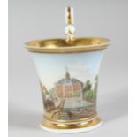 A SMALL MEISSEN CUP painted with a scene of Leipzig. Inscribed Leipzig, cross swords mark in blue.