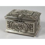 A. B. PARIS. A FINELY LINED AND CHASED CASKET with panels of figures. 6.5ins long.