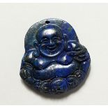 A CHINESE CARVED LAPIS PENDANT. 2ins.