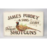 A PAINTED PLYWOOD SIGN "JAMES PURDEY & SONS". 2FT 10.5ins x 1ft 9.5ins.