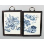A PAIR OF FRAMED CHINESE BLUE AND WHITE PLAQUES. 12ins x 10ins.