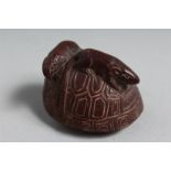 A JAPANESE CARVED WOOD NETSUKE, rats on shell. 1.25ins