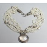 A DESIGNER NECKLACE with oval moonstones.