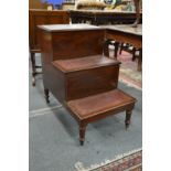 A set of 19th century mahogany and leather inset three tread library steps with storage.