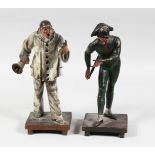 A PAINTED AUSTRIAN CLOWN with a hand bell, 10ins high and one of PIERROT 10ins high. (2).