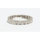 AN 18CT. WHITE GOLD AND DIAMOND ETERNITY RING.