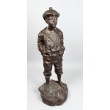 MARCEL AFTER V. SZEZE BLEWSKI. A LARGE BRONZE OF A YOUNG BOY WHISTLING. Signed 30ins high.