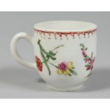 A BOW COFFEE CUP painted with coloured flowers under a line, dot and loop border.