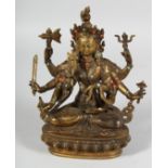 A CHINESE BRONZE GOD siting, with coral and turquoise. 8.5ins high.