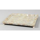 A GOOD MOTHER OF PEARL SHELL TRAY on bun feet. 11ins x 8.5ins