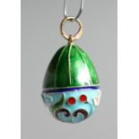 A RUSSIAN SILVER AND ENAMEL EGG PENDANT.