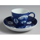 A BOW POWDER BLUE COFFEE CUP AND SAUCER painted with landscapes in fan shaped panels.
