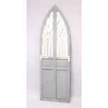 A RUSTIC ARCH SHAPED GARDEN MIRROR with grey painted decoration. 5ft 11.5ins high x 1ft 10.5ins