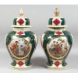 A LARGE PAIR OF VIENNA BULBOUS VASES AND COVERS painted with figures in a classical panel. 17ins
