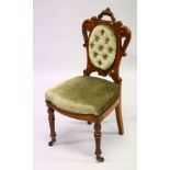 A VICTORIAN CARVED WALNUT AND UPHOLSTERED SINGLE CHAIR on turned legs.