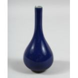 A DARK BLUE PORCELAIN VASE with a long neck. 6ins high.