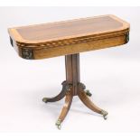 A SUPERB REGENCY ROSEWOOD CROSS BANDED FOLDING TOP CARD TABLE with brass mounts, centre column