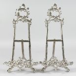 A PAIR OF SILVERED EASELS 15ins