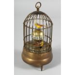 A SINGING BIRD CAGE CLOCK. 7ins high.