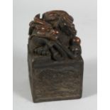 A CHINESE BRONZE DRAGON SQUARE SEAL. 5ins high.