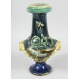 A PALISSY TYPE MAJOLICA VASE with moths entwined snakes with garlands and lion ring handles. 15ins