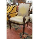 A French Empire revival mahogany framed open armchair.
