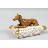 A PORCELAIN BOX AND COVER with a greyhound. 6ins long.