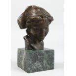 A BRONZE BUST OF A YOUNG GIRL. Signed, 3.5ins on a marble plinth.