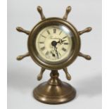 A SMALL BRASS SHIP'S WALL CLOCK. 6ins high.