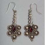 A PAIR OF SILVER AND GARNET DROP EARRINGS.