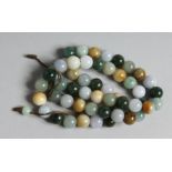 A JADE AND NEPHRITE BEAD NECKLACE 21ins long